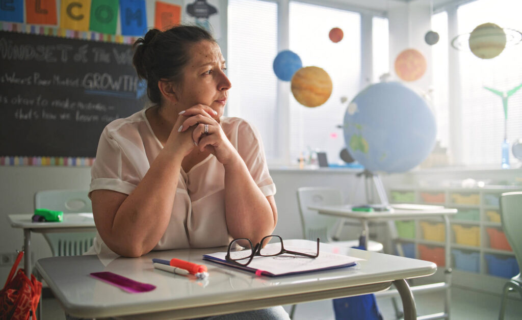 Sad teacher in clasroom